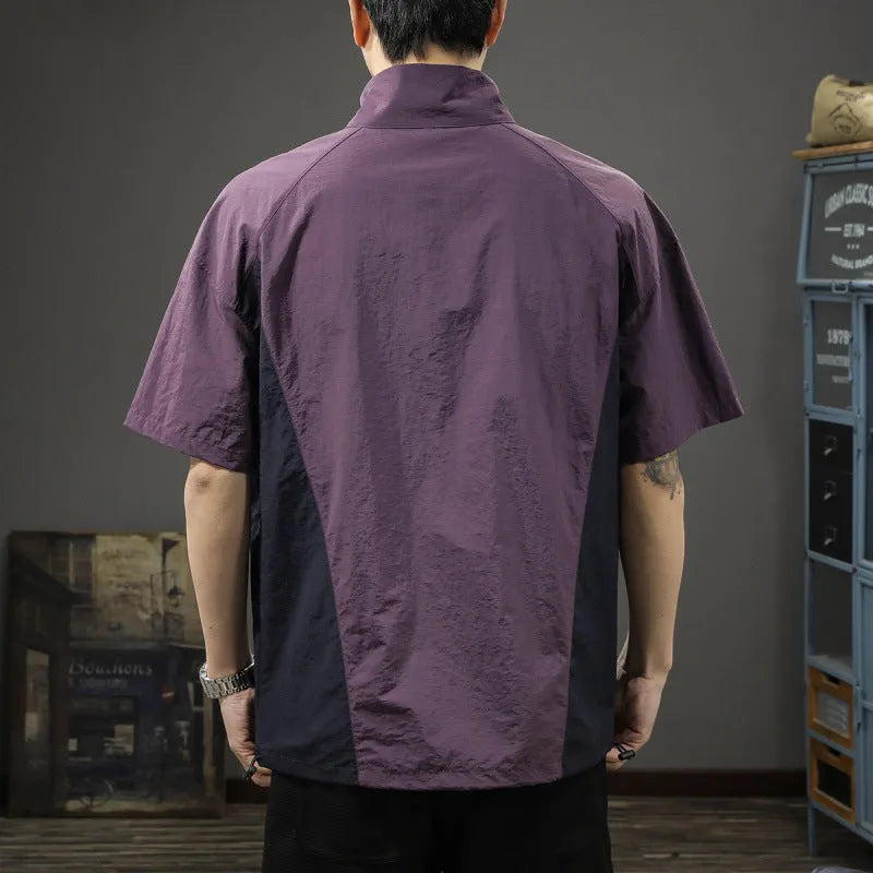 Brown men's half-zipped stand collar short-sleeved shirt on a hanger, showing fleece lining.