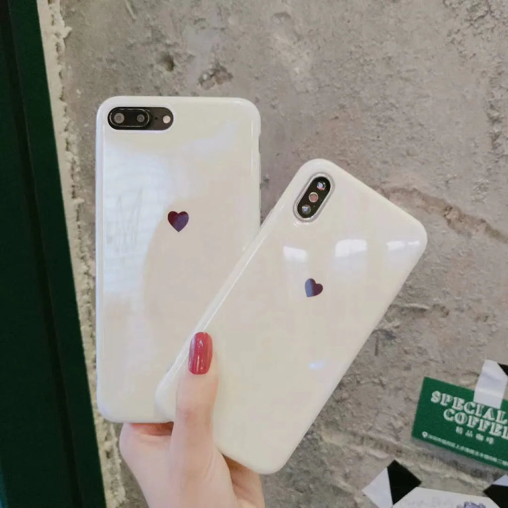 Slim white hard back cover case for iPhone X, shown next to a Bluwhite variant.