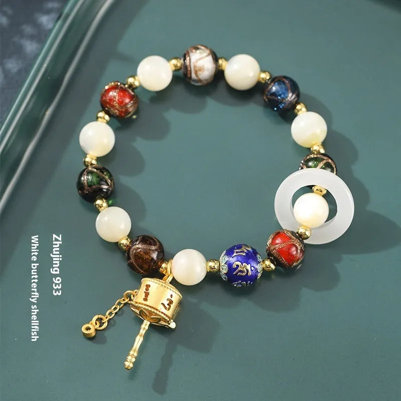 Hand-woven fragrant grey coloured glaze bracelet with sunstone and white lip shell beads