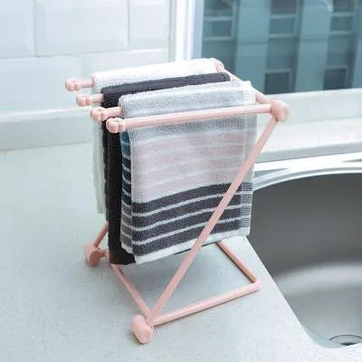 Foldable plastic dishcloth shelf in light blue with bottles stored vertically