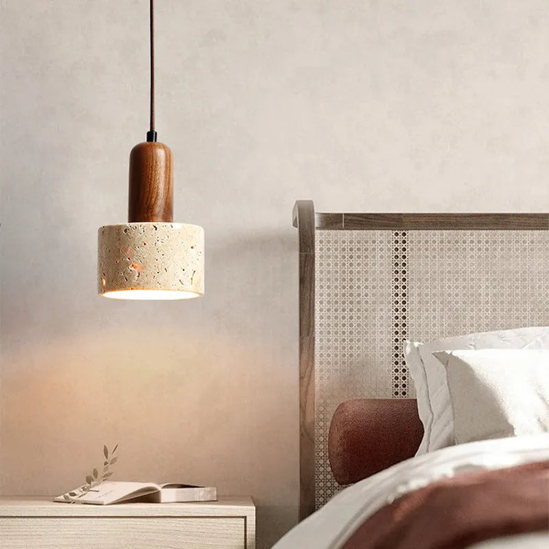 Yellow cave stone wabi sabi style marble bedside pendant light on a wooden surface