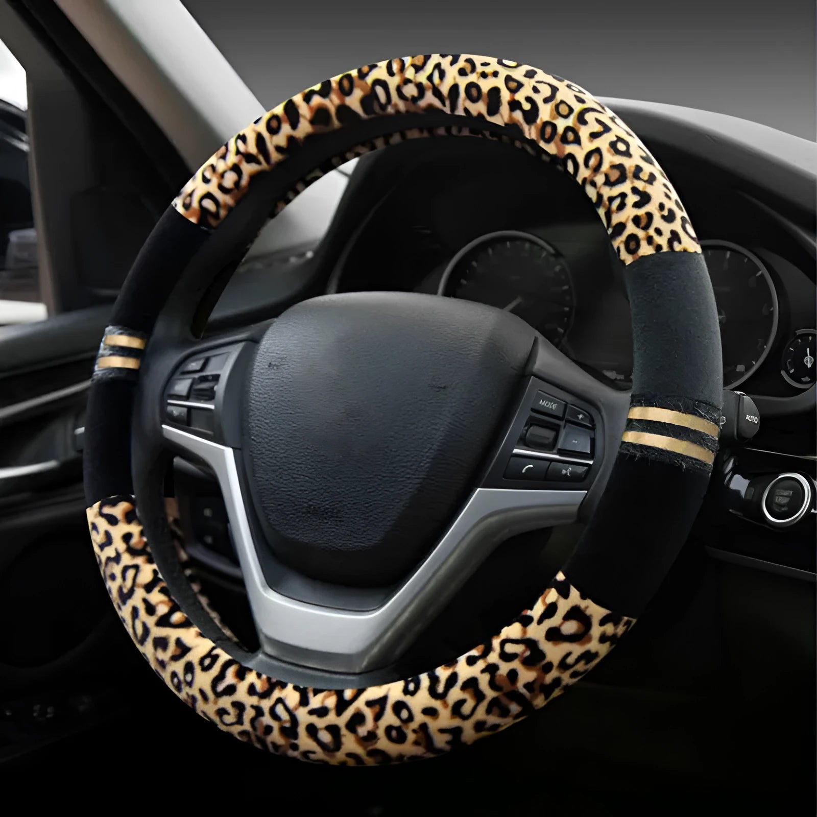 Winter plush car steering wheel cover in beige with leopard grain pattern on a GM steering wheel