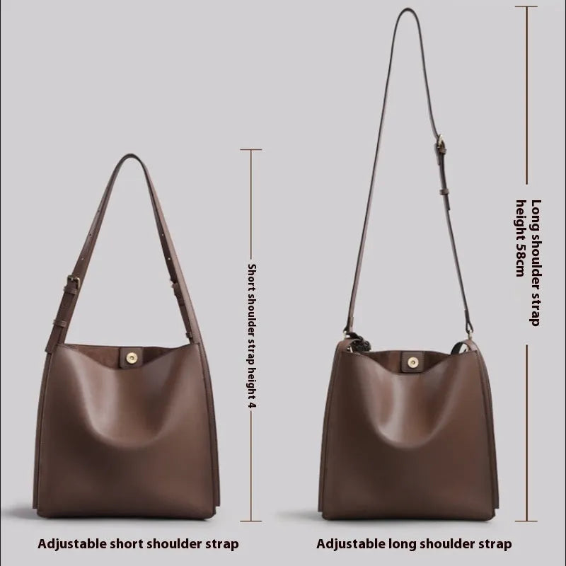 Genuine leather women's bucket bag with shoulder straps showing internal organisation compartments