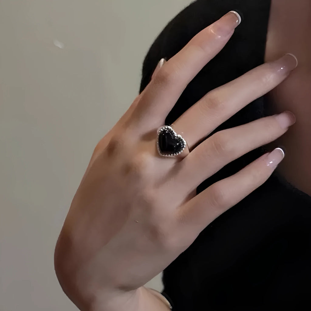 S925 sterling silver ring with black heart agate stone on an adjustable band.
