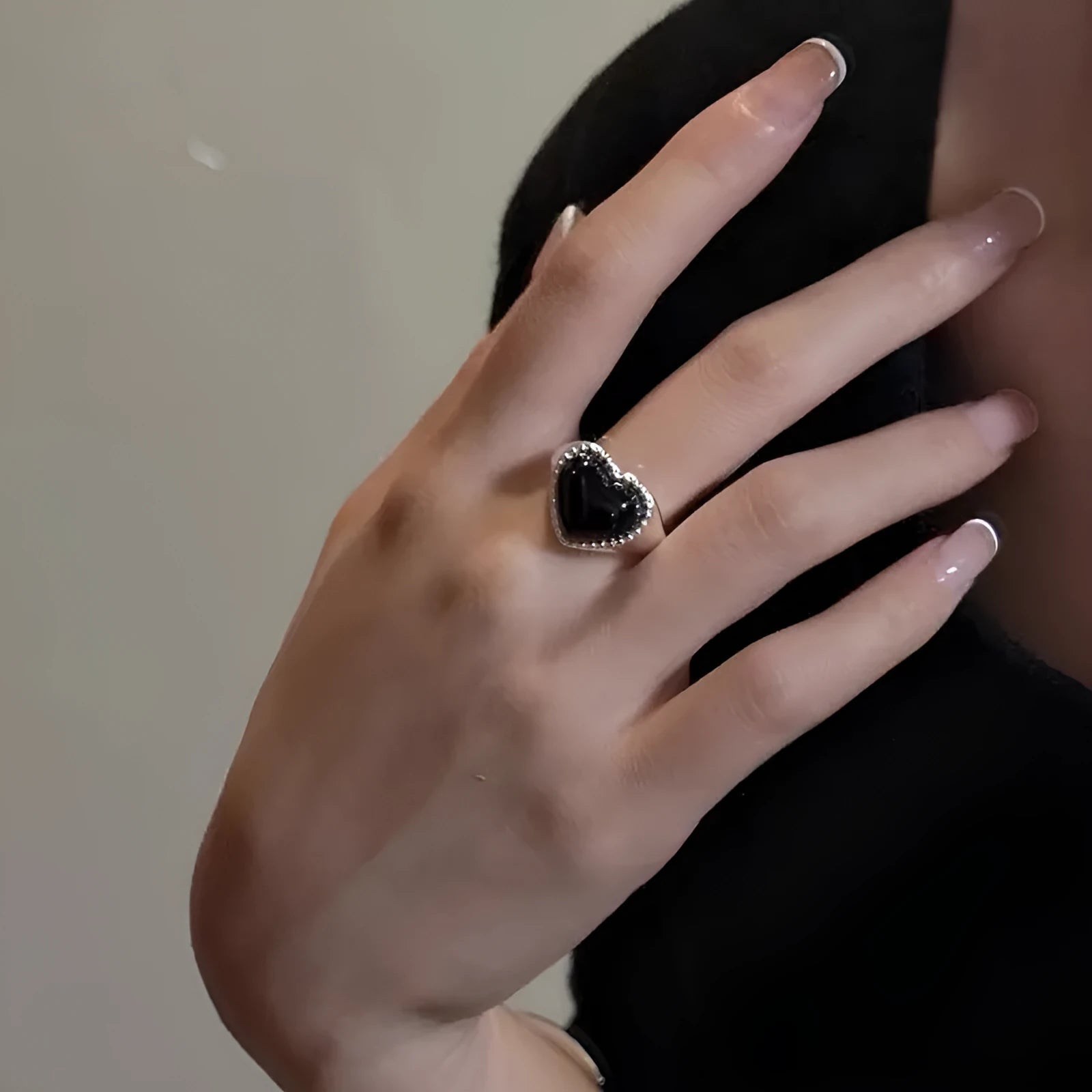 S925 sterling silver ring with black heart agate stone on an adjustable band.