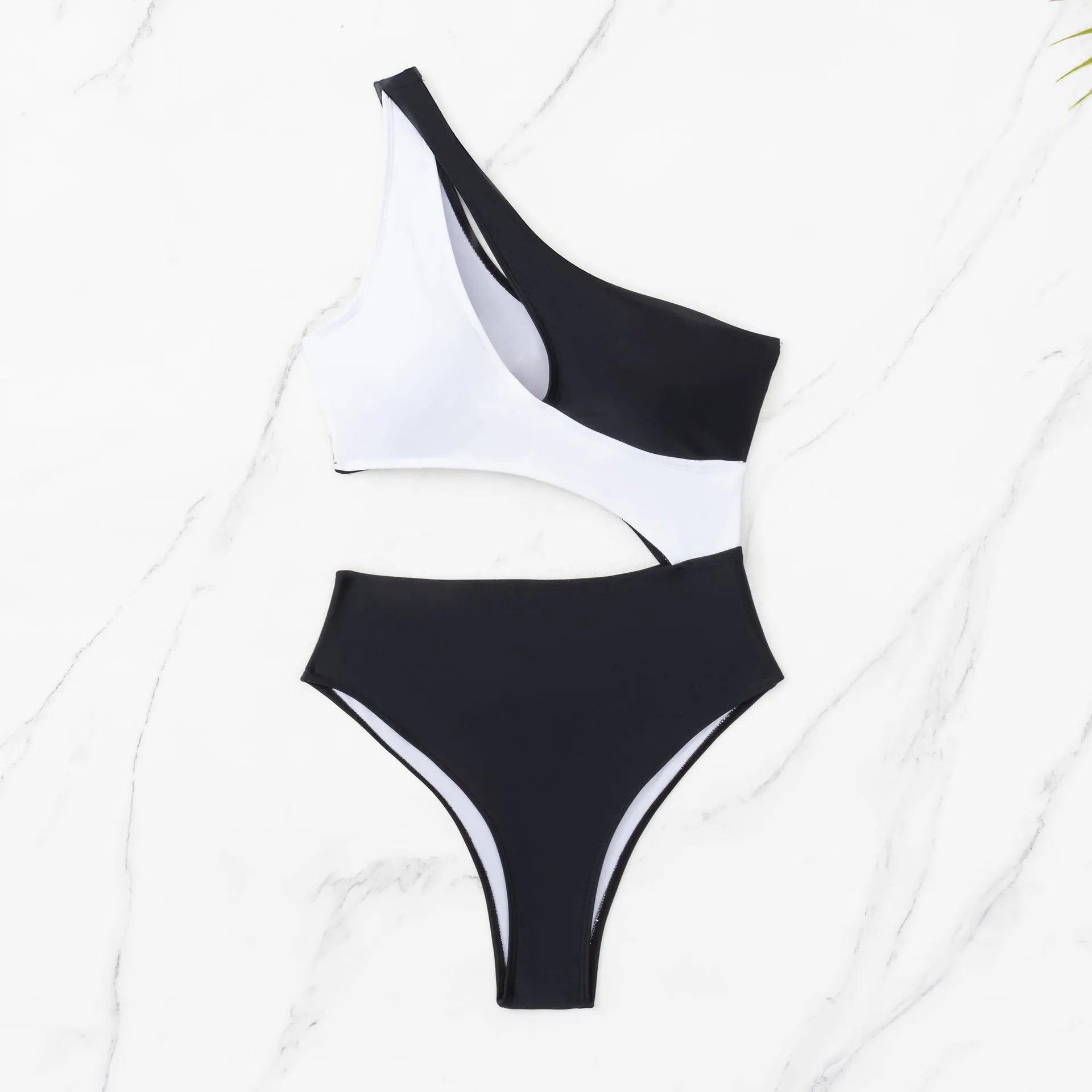 Black women's one-piece swimsuit with white contrast stitching and hollow cut-out design on a mannequin