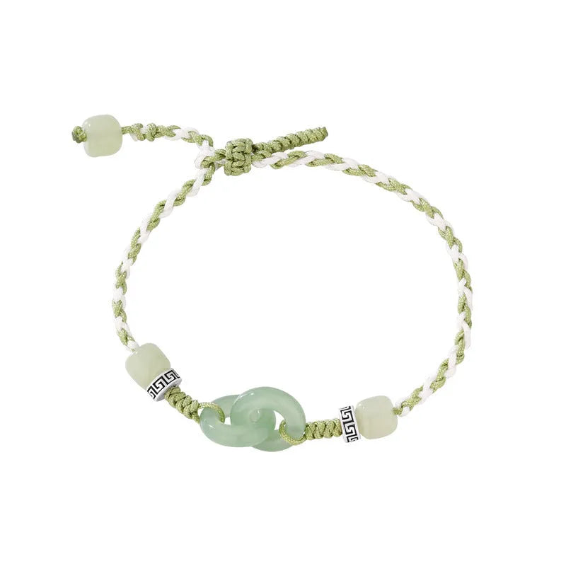 Women's ethnic style copper bracelet with peace buckle and double ring design in green.