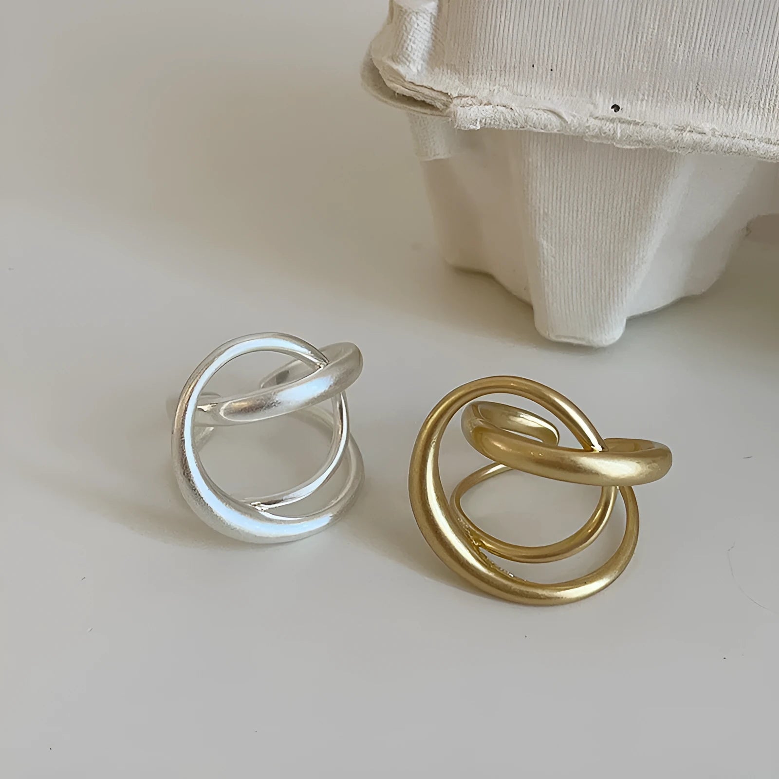 Three-dimensional interlaced matte metal open ring with geometric design in gold or silver electroplated finish