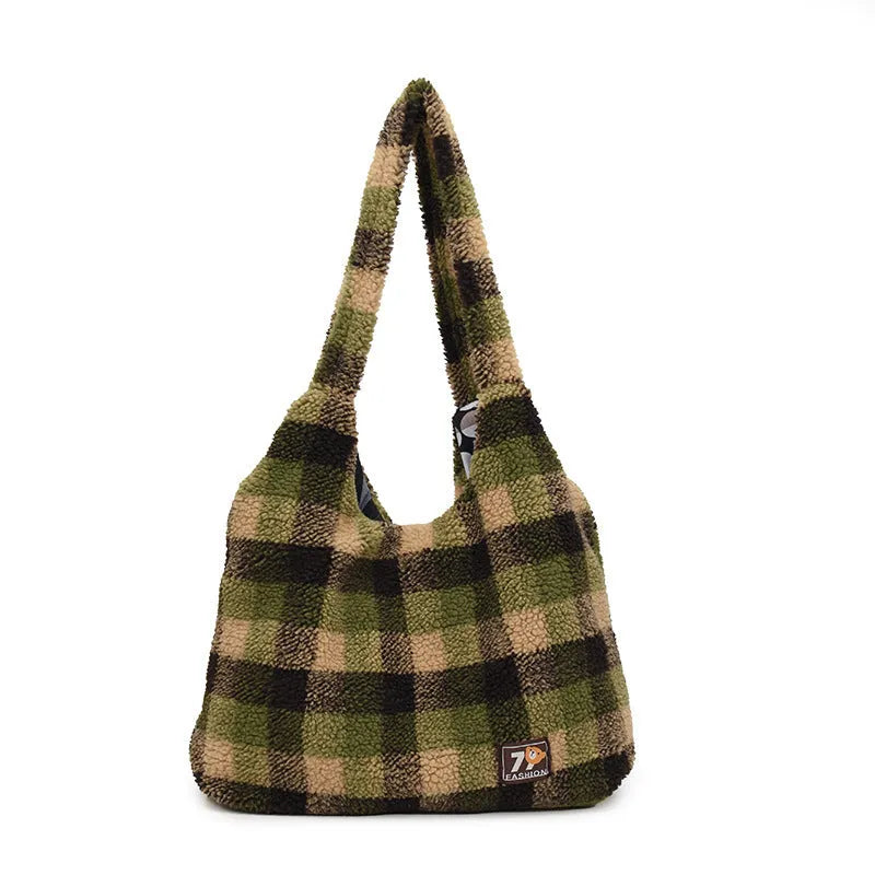 Women's plaid crossbody tote bag in soft plush fabric showing horizontal square shape and strapless shoulder strap