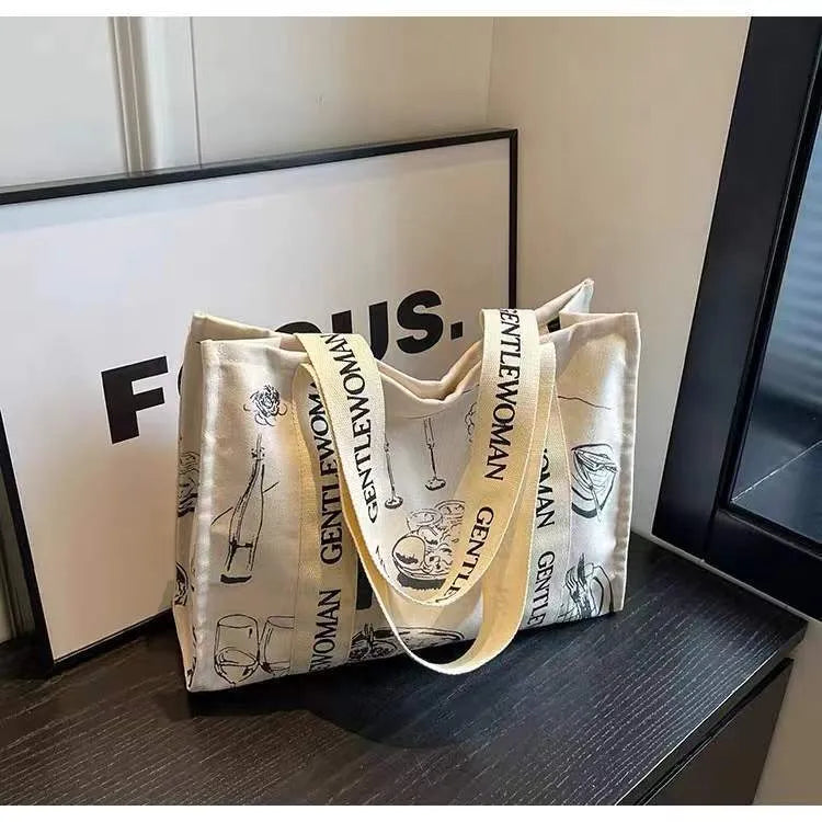 Large canvas tote bag with printed design, showing substantial capacity and casual styling