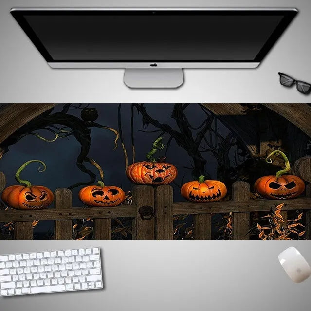 Oversized Halloween pattern rubber cloth mouse pad on a desk with non-slip base.