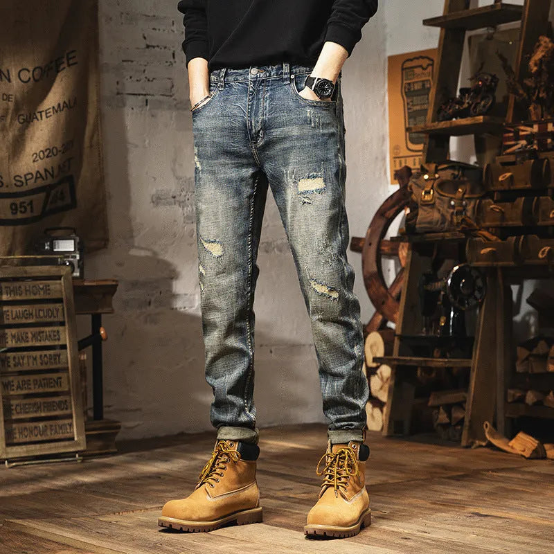Man wearing vintage blue loose straight-leg jeans with a fleece lining and drawstring waist.