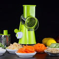 Round mandoline slicer with three stainless steel blades and a suction base in blue green, green, or red