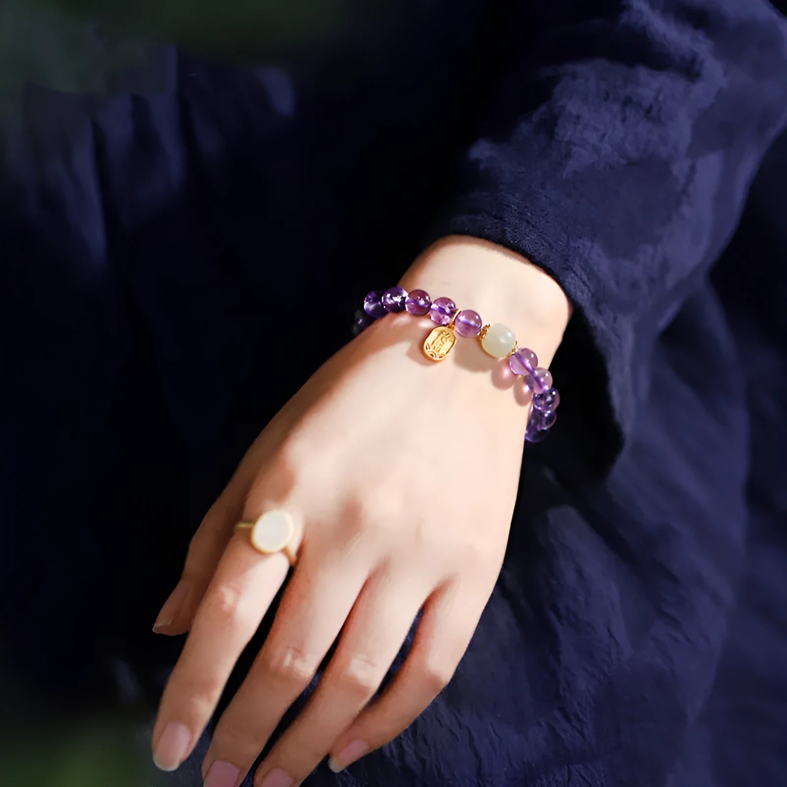 Women's amethyst bracelet with 8mm crystal beads in a geometric, national style design.