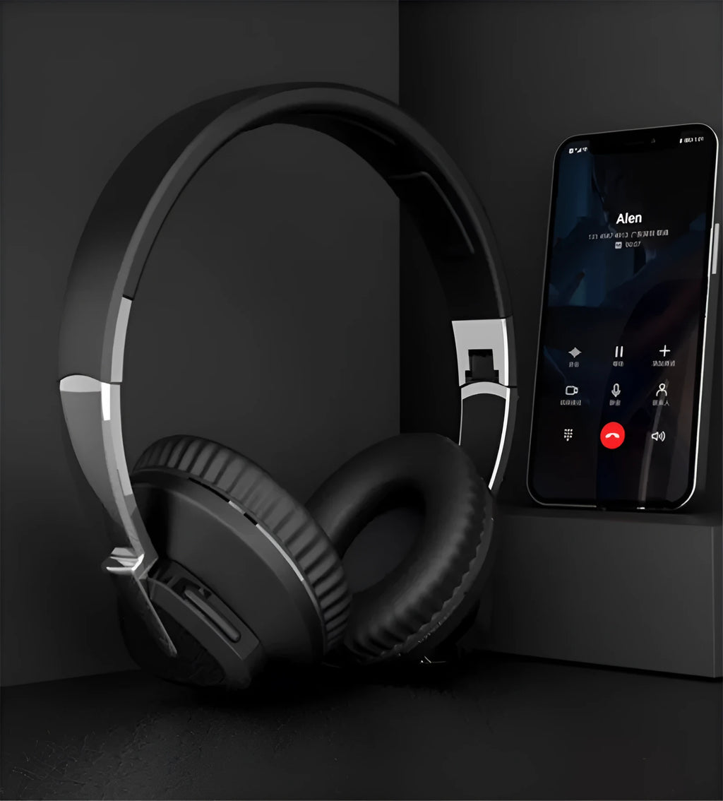 Black wireless over-ear headset with AUX cable and TF card slot, showing soft ear cups and control buttons.