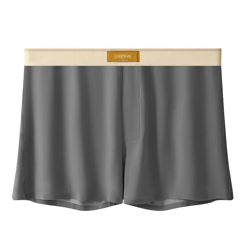 Pack of three men's solid colour loose fit ice silk boxer shorts on a white background