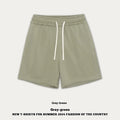 Loose fit cotton denim trousers for toddler in khaki colour on a hanger