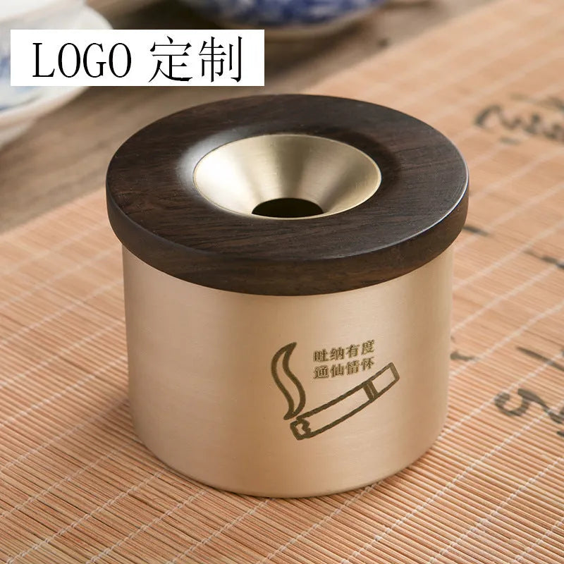 Retro brass ashtray with wooden lid showing centre hole design
