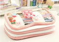 Transparent heart-shaped pencil case with Korean style design in pink rabbit theme showing pens inside