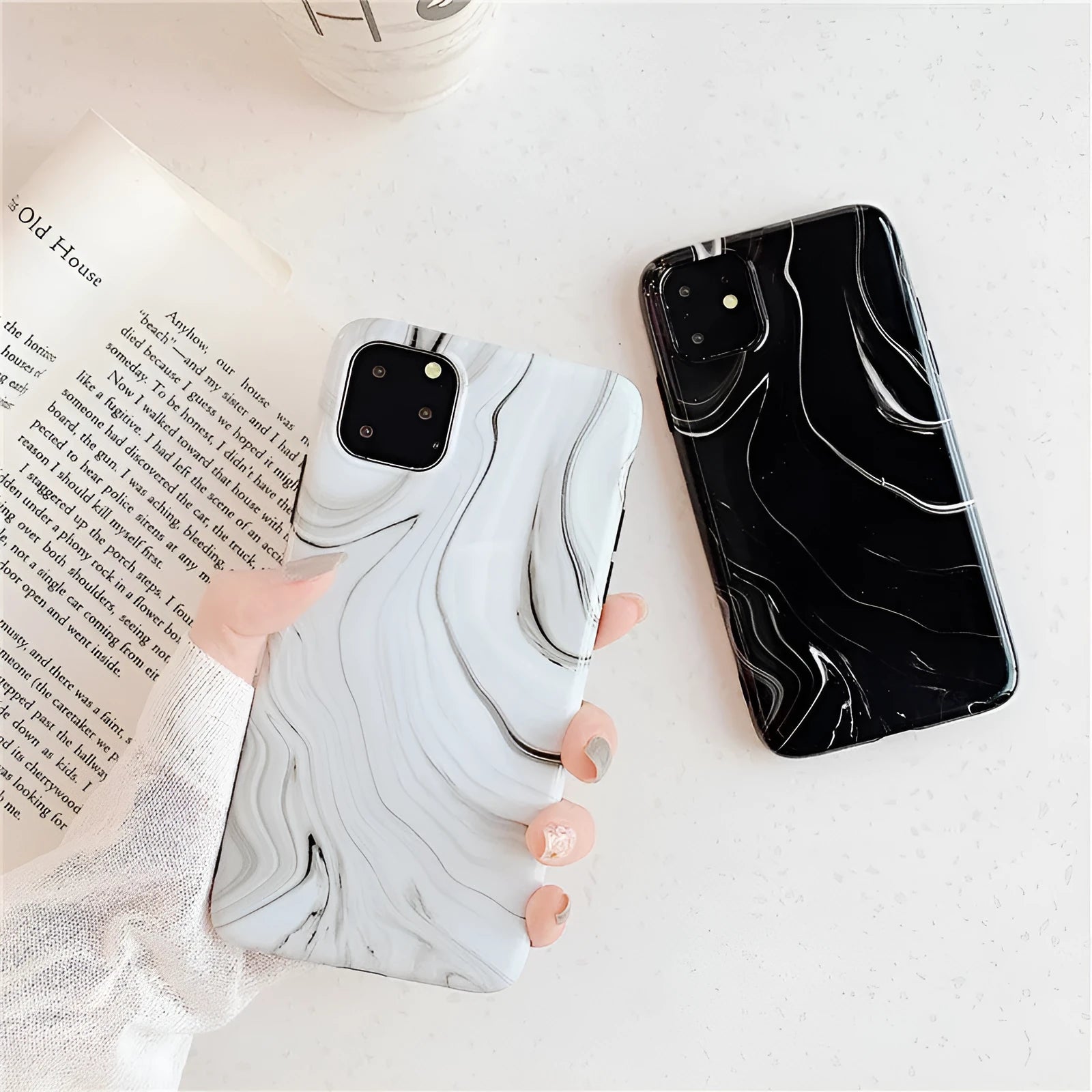 Marble mobile phone case for iPhone in black and white soft shell design, showing fade-resistant pattern