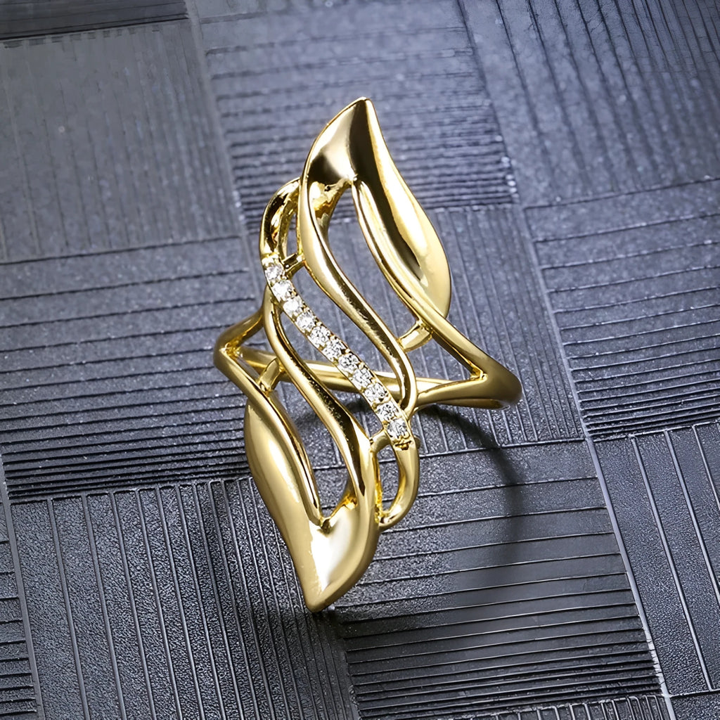 Women's copper ring with exaggerated curved design and zircon stone accents in gold colour