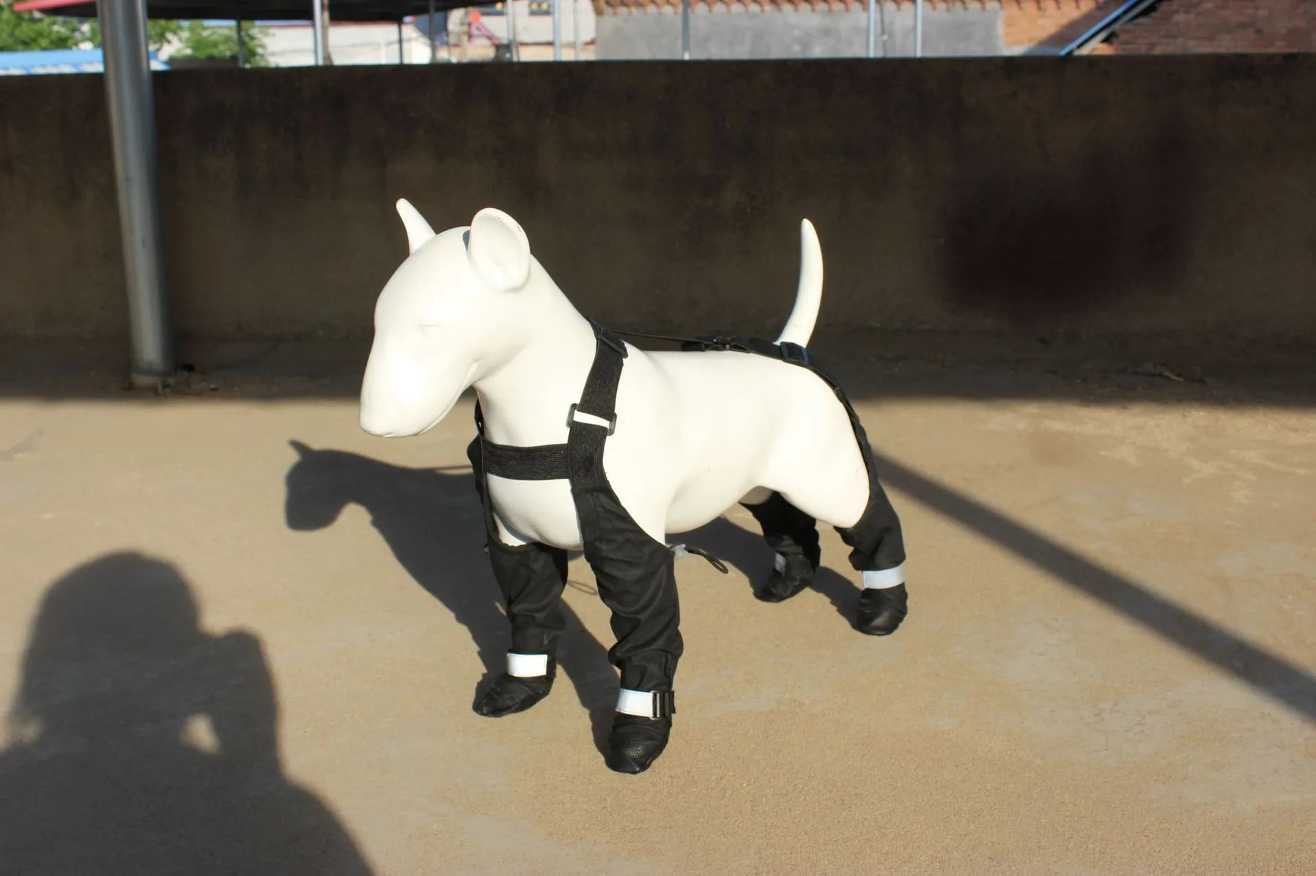 Black waterproof dog shoes with adjustable straps and non-slip soles for paw protection