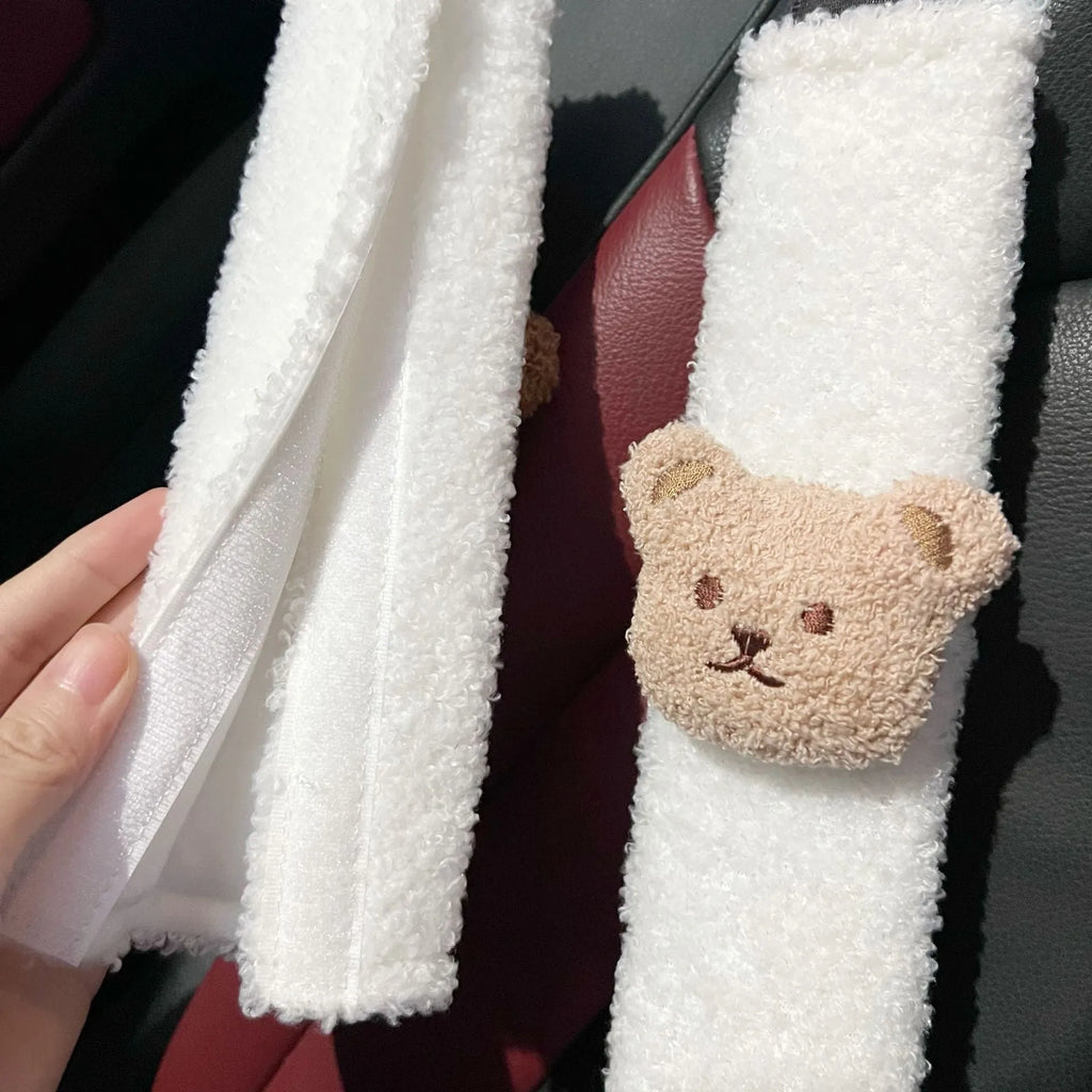 Cartoon bear plush seat belt shoulder cover for child car safety measuring 25cm by 6.5cm by 5cm.