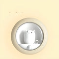 Colour-changing sleep night light with projection feature on a bedside table.