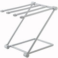 Foldable plastic dishcloth shelf in light blue with bottles stored vertically