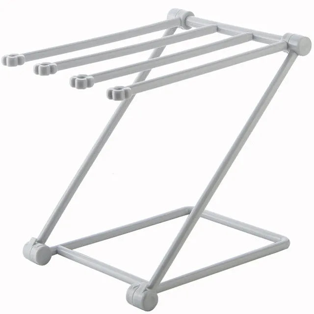 Foldable plastic dishcloth shelf in light blue with bottles stored vertically