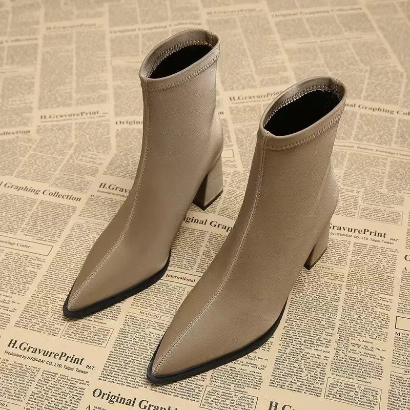 Women's khaki pointed toe Martin boots with a wedge heel and stretch artificial velboa upper.