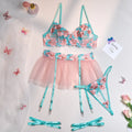 Pink women's mesh pettiskirt and bikini set with embroidery detail.