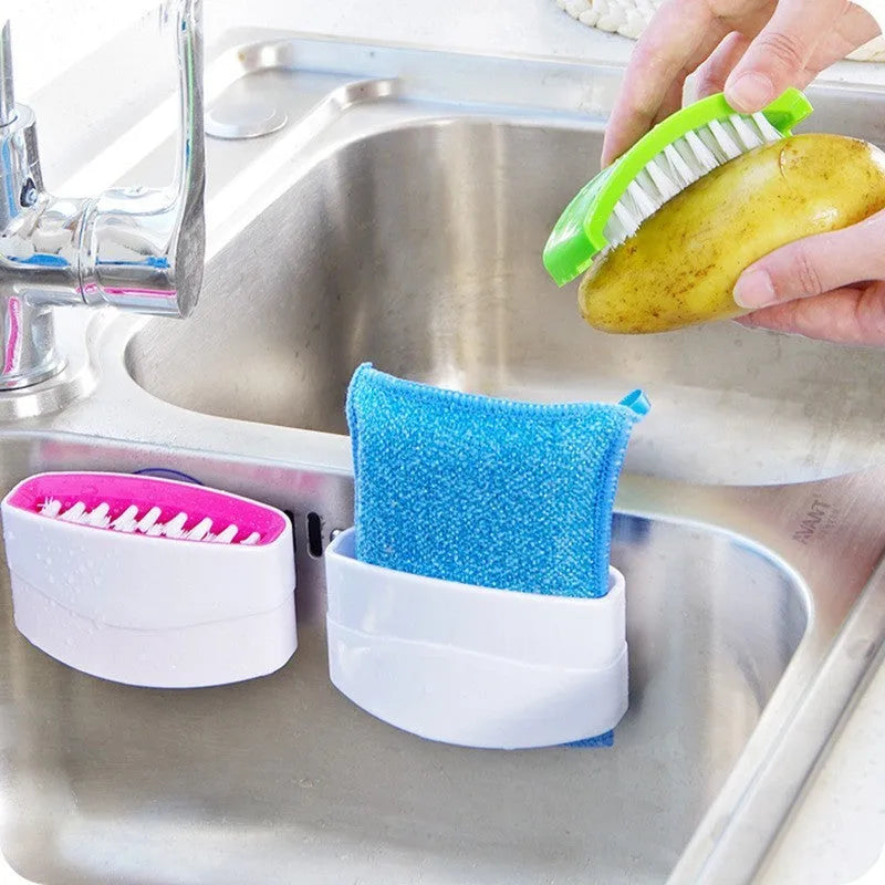 Kitchen cleaning brush with suction cup base and cutlery grooves in blue, green or pink
