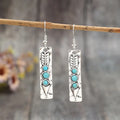 Silver geometric retro earrings with inlaid turquoise detail on zinc alloy
