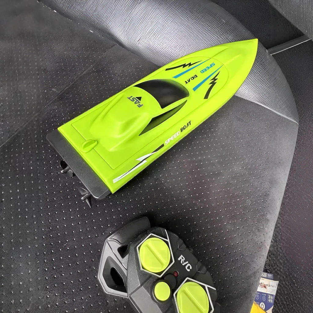 Simulation electric remote-control ship toy double paddle high-speed boat in orange colour on water