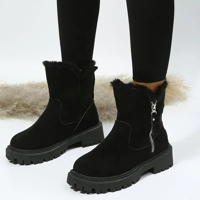Women's black high-top snow boots with a side zipper and round toe on a non-slip rubber sole.
