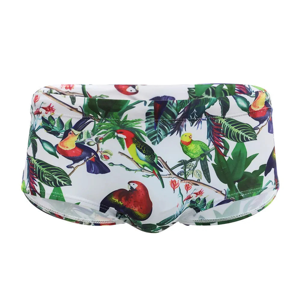 Men's swimming trunks with flower-bird print pattern in nylon fabric showing briefs style