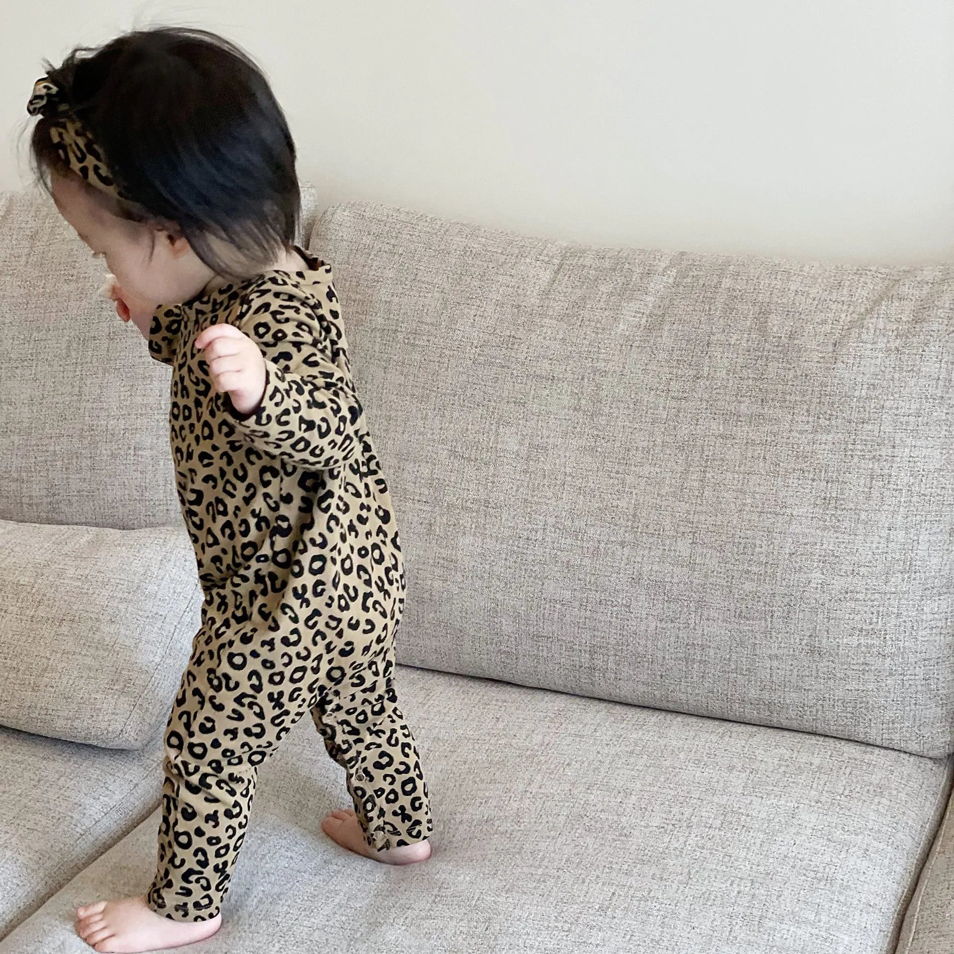 Brown leopard print cotton long-sleeved baby jumpsuit with matching headband