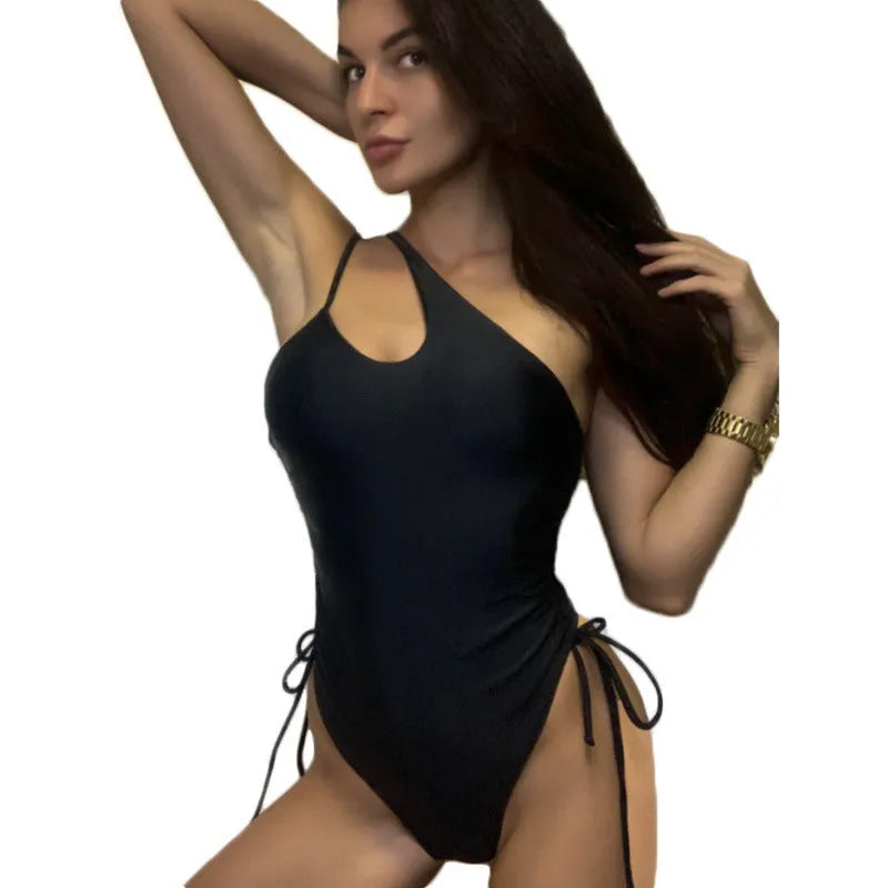 Black women's dress with sloping shoulder design and tight-fitting sleeveless cut