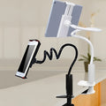 Black and white flexible mount holder with adjustable clamp and suction cup base holding a tablet