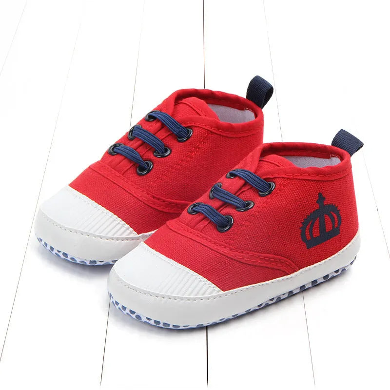 Red and white canvas toddler shoes with elastic band closure in three size options