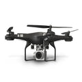 Black alloy remote control HD aerial photography drone with a handheld controller on a grassy field.