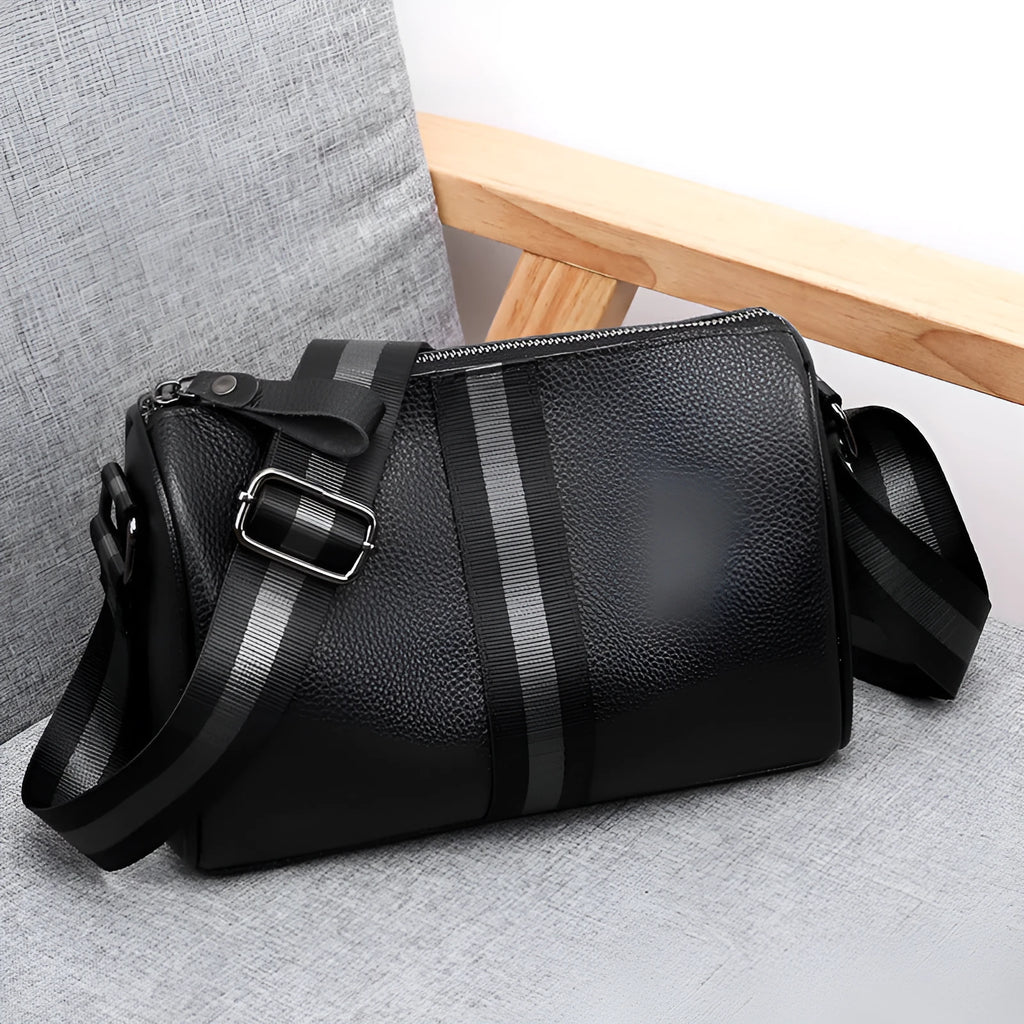 Black genuine leather women's crossbody bag with one shoulder strap showing large capacity dimensions