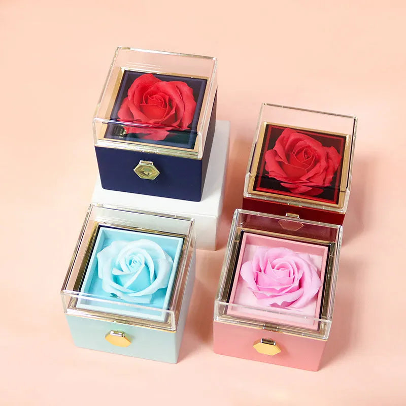 Rotating rose jewellery gift box with acrylic transparent cover showing preserved rose and rotating drawer open.