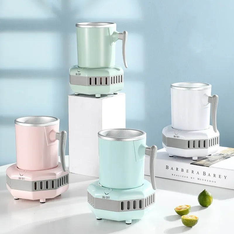 White portable mini cooling cup with base and power adapter for quick drink chilling.