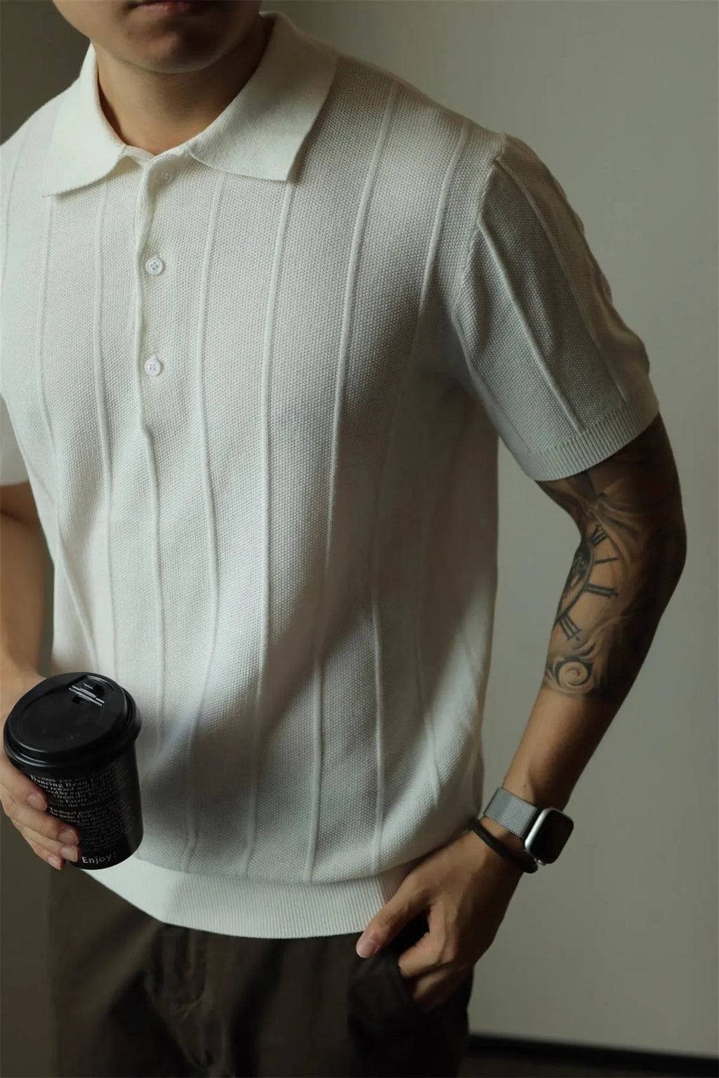 Men's loose fit solid colour t-shirt in black or white, made from polyester fabric.