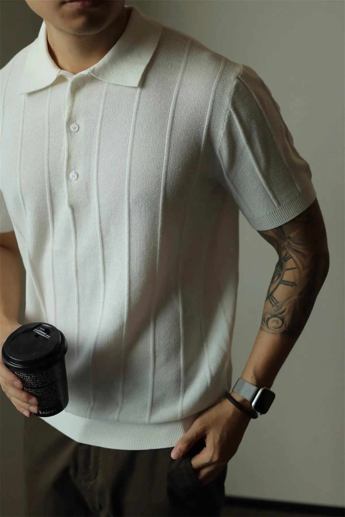 Men's loose fit solid colour t-shirt in black or white, made from polyester fabric.