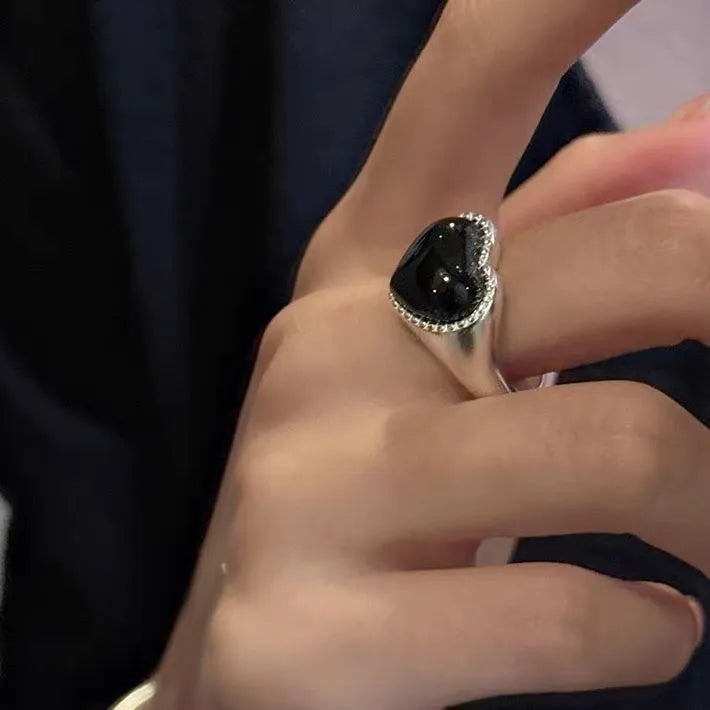 S925 sterling silver ring with black heart agate stone on an adjustable band.
