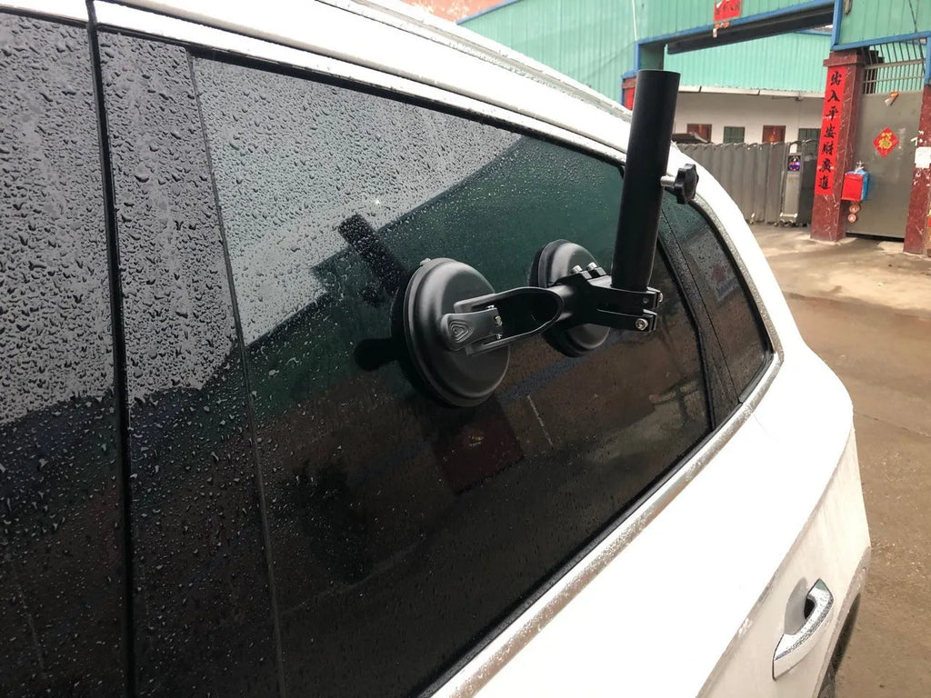 Black off-road car sucker base with round rubber suction cup for mounting on vehicle windows.
