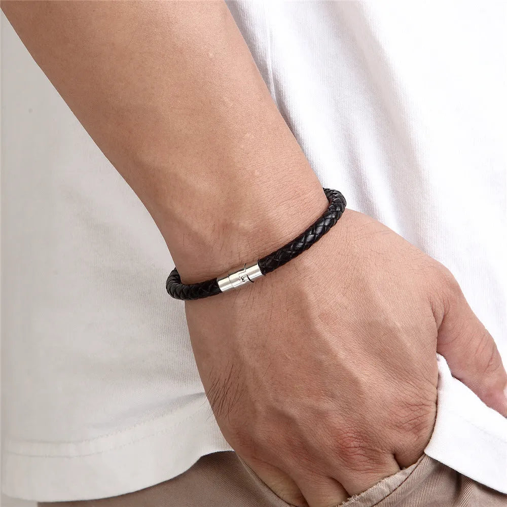 Men's titanium steel geometric wire bracelet with a magnetic clasp in black, shown on a wrist.